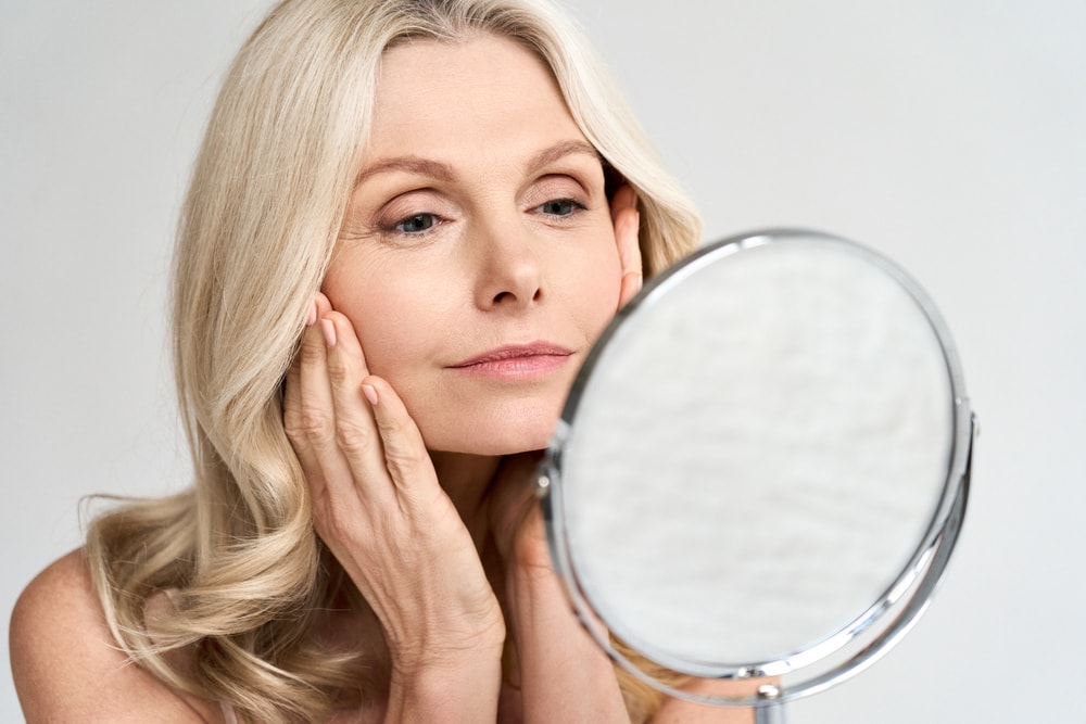 Woman looking in a mirror